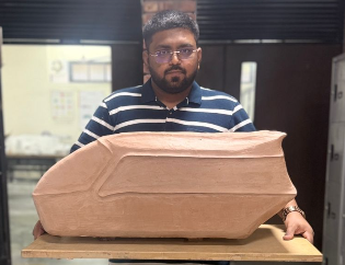 Roodren Patel with clay model